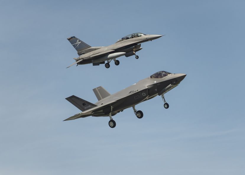 Chased by a LM two-seat F-16 the first F-35A destined to the Turkish Air Force flies over Ft. Worth.