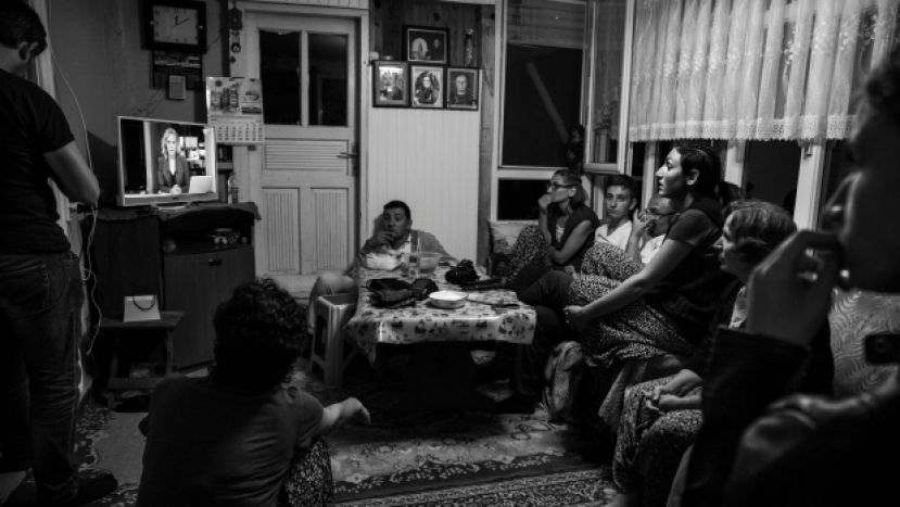 A family in Turkey watches the attempted military coup unfold on the state television network TRT on July 15, 2016. (Mustafa Can Koca)