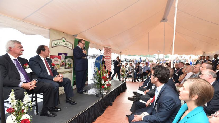Murat Guzel, CEO Natural Food Group gives a few remarks during a ribbon cutting ceremony as local leaders and community members gather at the expanding business Natural Food Group in Whitehall. Natural Food Group is donating nonperishable food for flood victims in Houston. Among the thousands of pounds that will be donated include an entire pallet of dried apricots in five pound bags among other products.