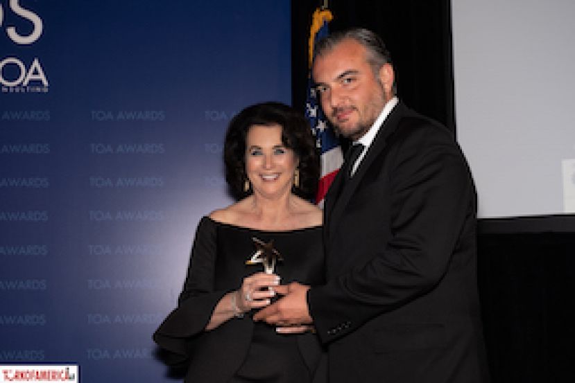 Mona Diamond receives her plaque from Barbaros Karaahmet, Partner and Co-Chair of Herrick, Feinstein.