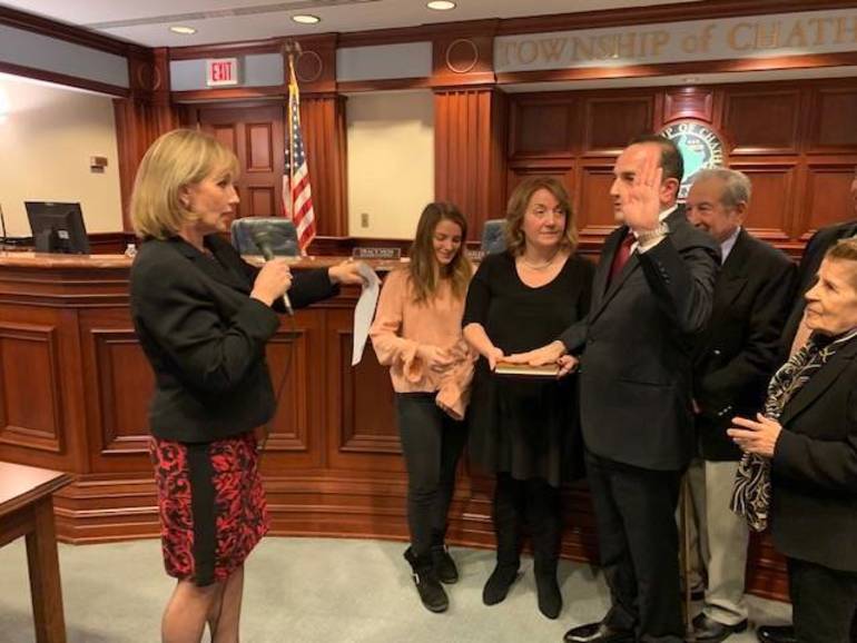 Tayfun Selen takes the oath of office as Chatnam Township Mayor with former Lt Governor Kim Guadagno doing the honors. Credit:TAP Chatnam