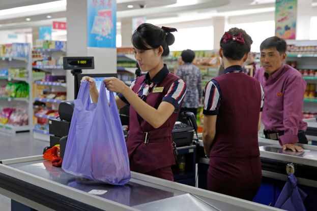 North Koreans work at a supermarket in Pyongyang.CreditCreditKin Cheung/Associated Press